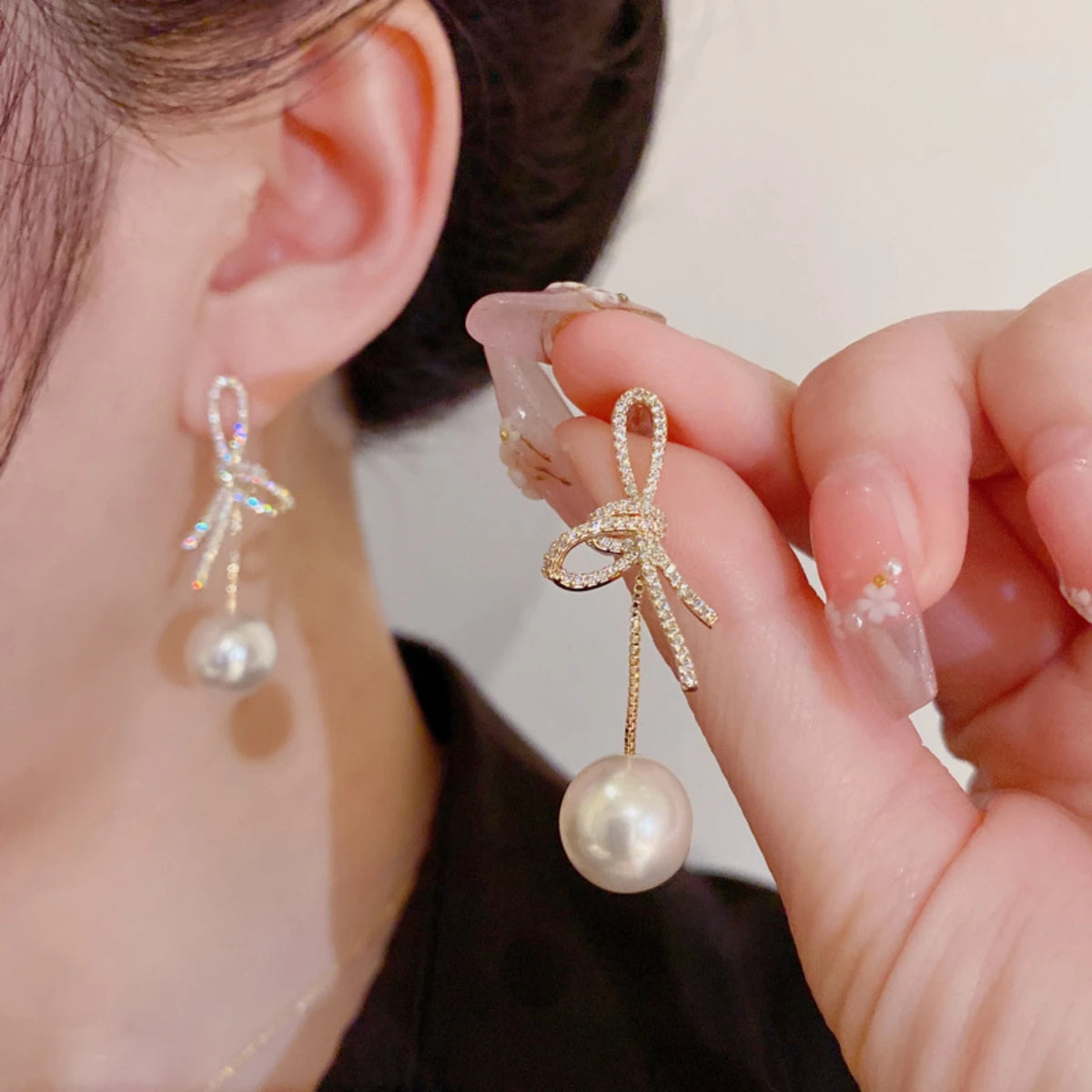 Silver Needle Bow Studded With Diamond Pearl Earrings