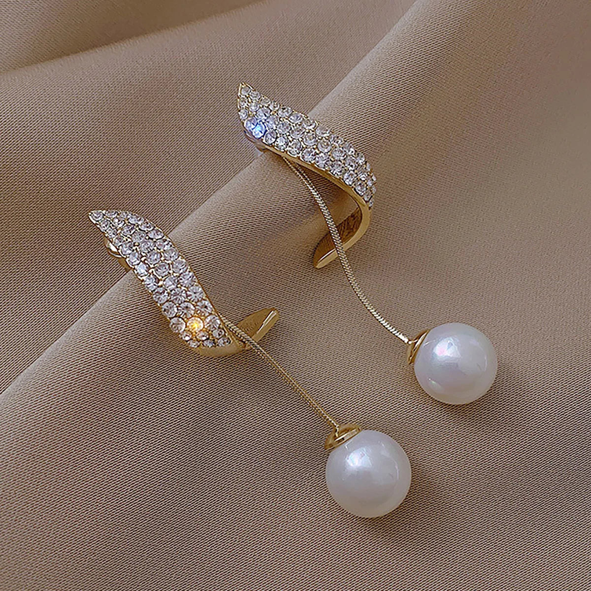 Silver Needle Bow Studded With Diamond Pearl Earrings