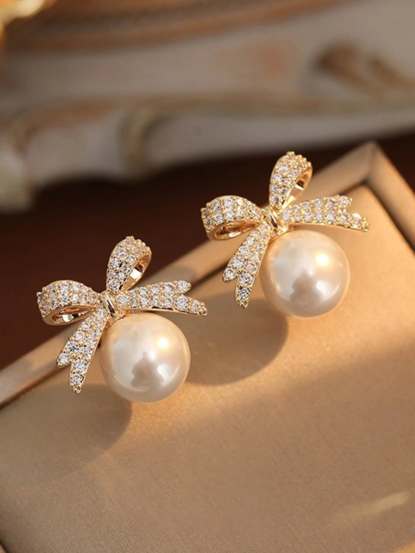 Silver Needle Bow Studded With Diamond Pearl Earrings